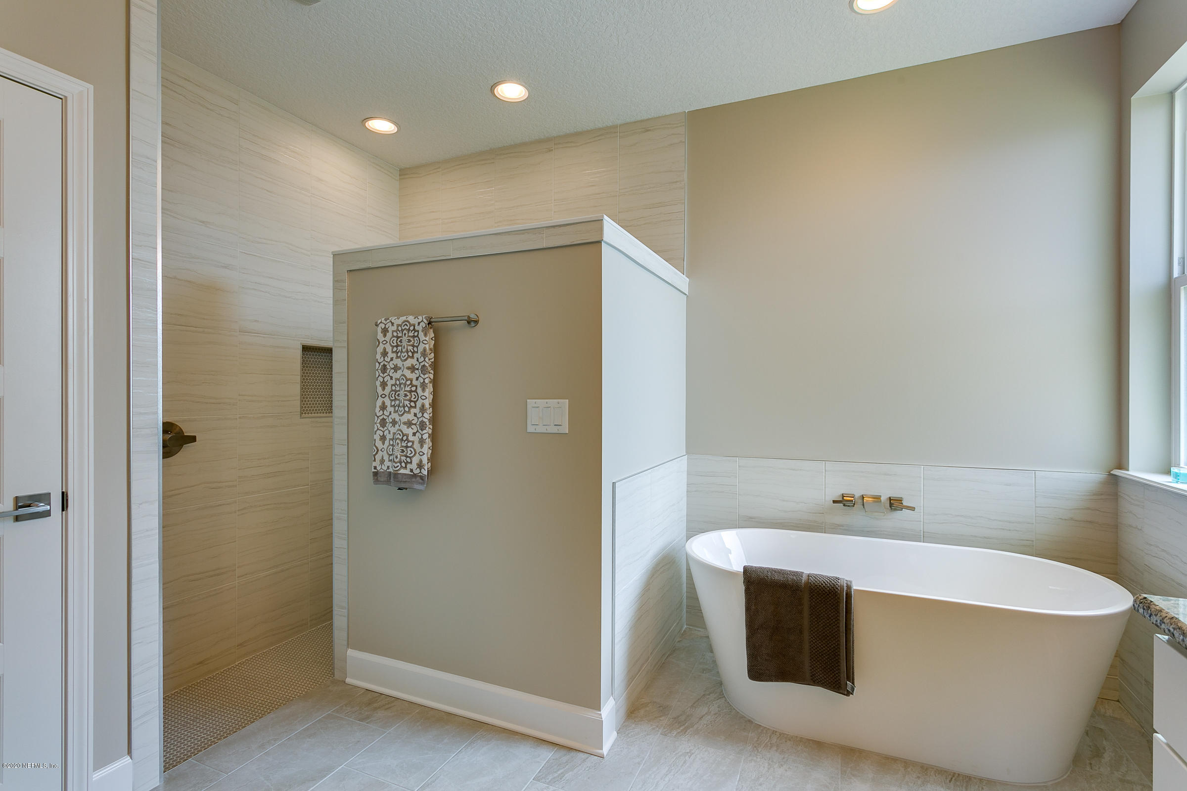 596 West Bianca Circle St. Augustine, FL 32086 - Photo 23 of 37 a bathroom with a tub and sink