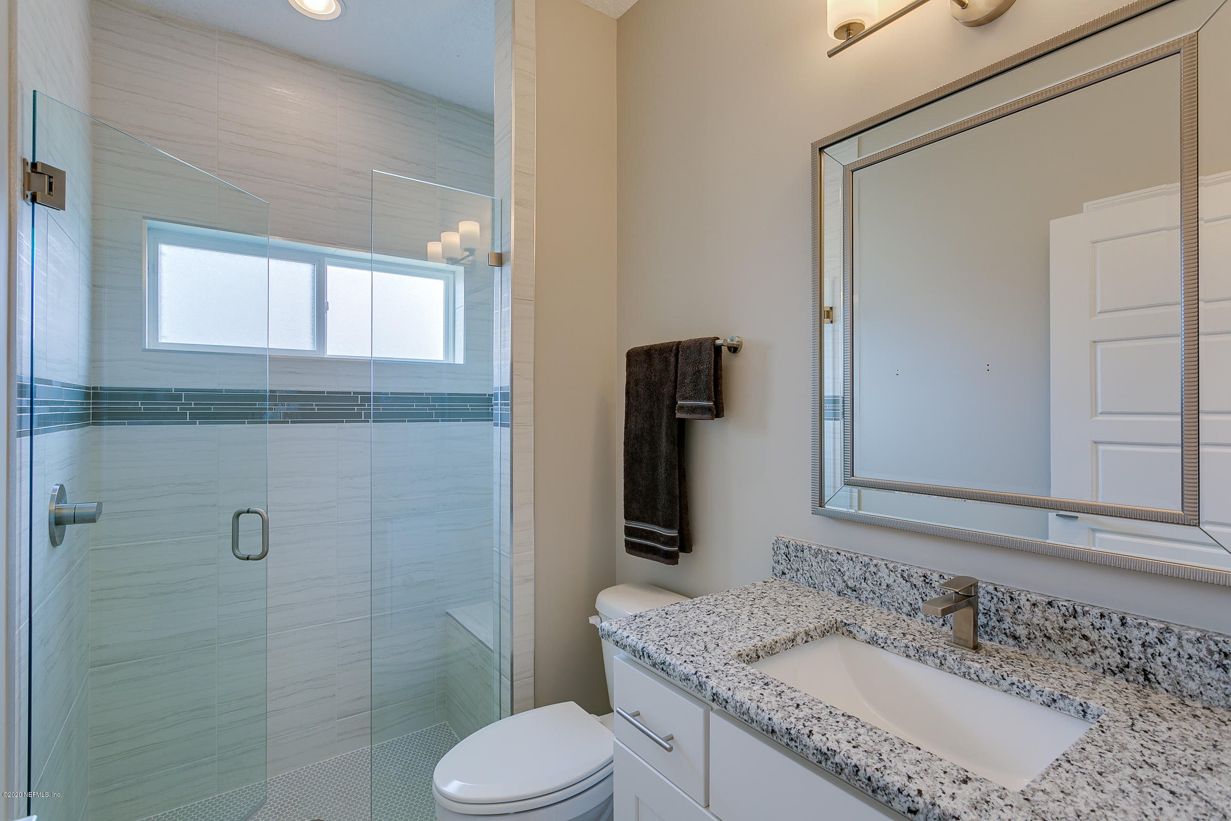 596 West Bianca Circle St. Augustine, FL 32086 - Photo 31 of 37 a bathroom with a granite countertop sink toilet and shower