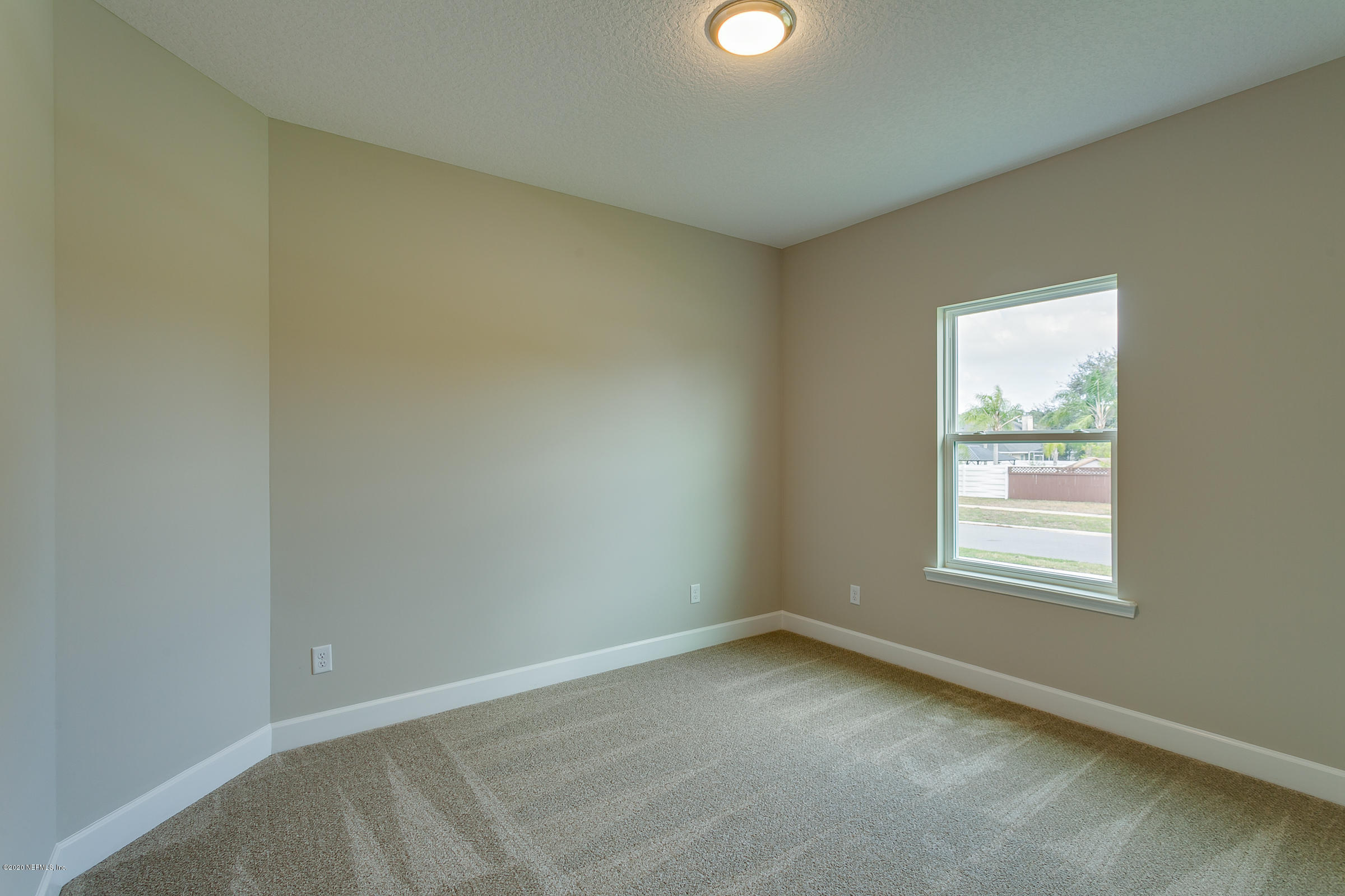 596 West Bianca Circle St. Augustine, FL 32086 - Photo 32 of 37 an empty room with a window