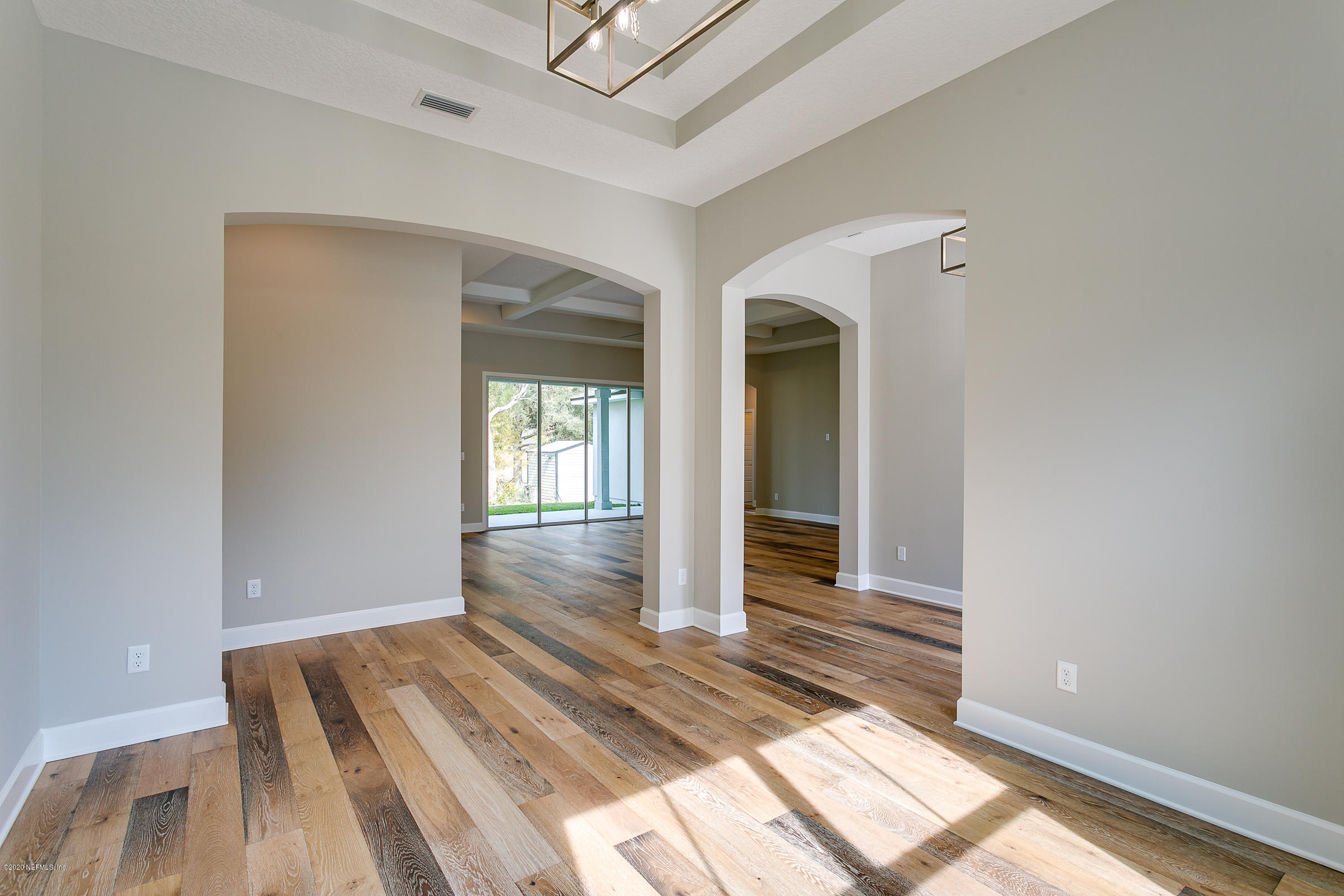 596 West Bianca Circle St. Augustine, FL 32086 - Photo 8 of 37 a view of a bedroom with wooden floor
