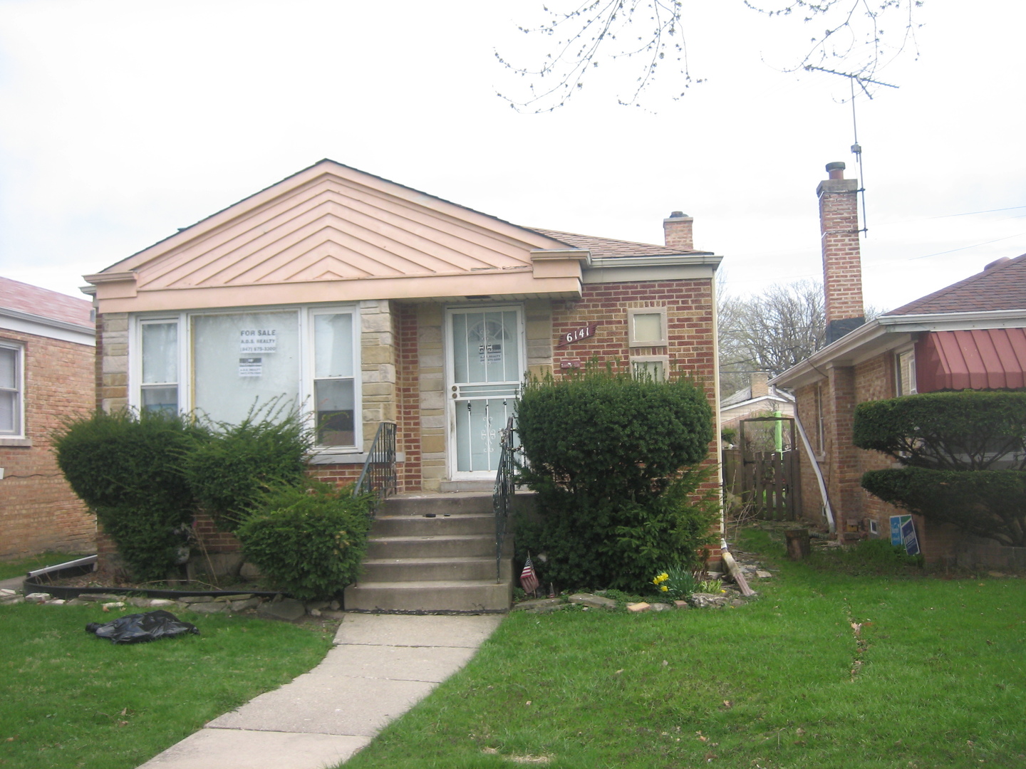 6141 North Harding Avenue Chicago, IL 60659 - Photo 1 of 11 a view of a house with a yard