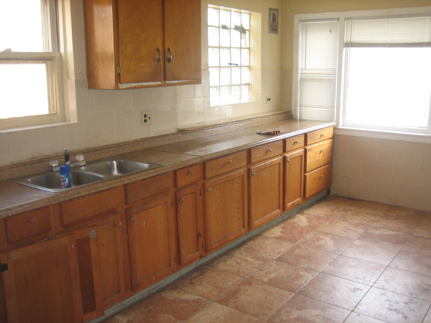 6141 North Harding Avenue Chicago, IL 60659 - Photo 11 of 11 a kitchen with a sink window and cabinets
