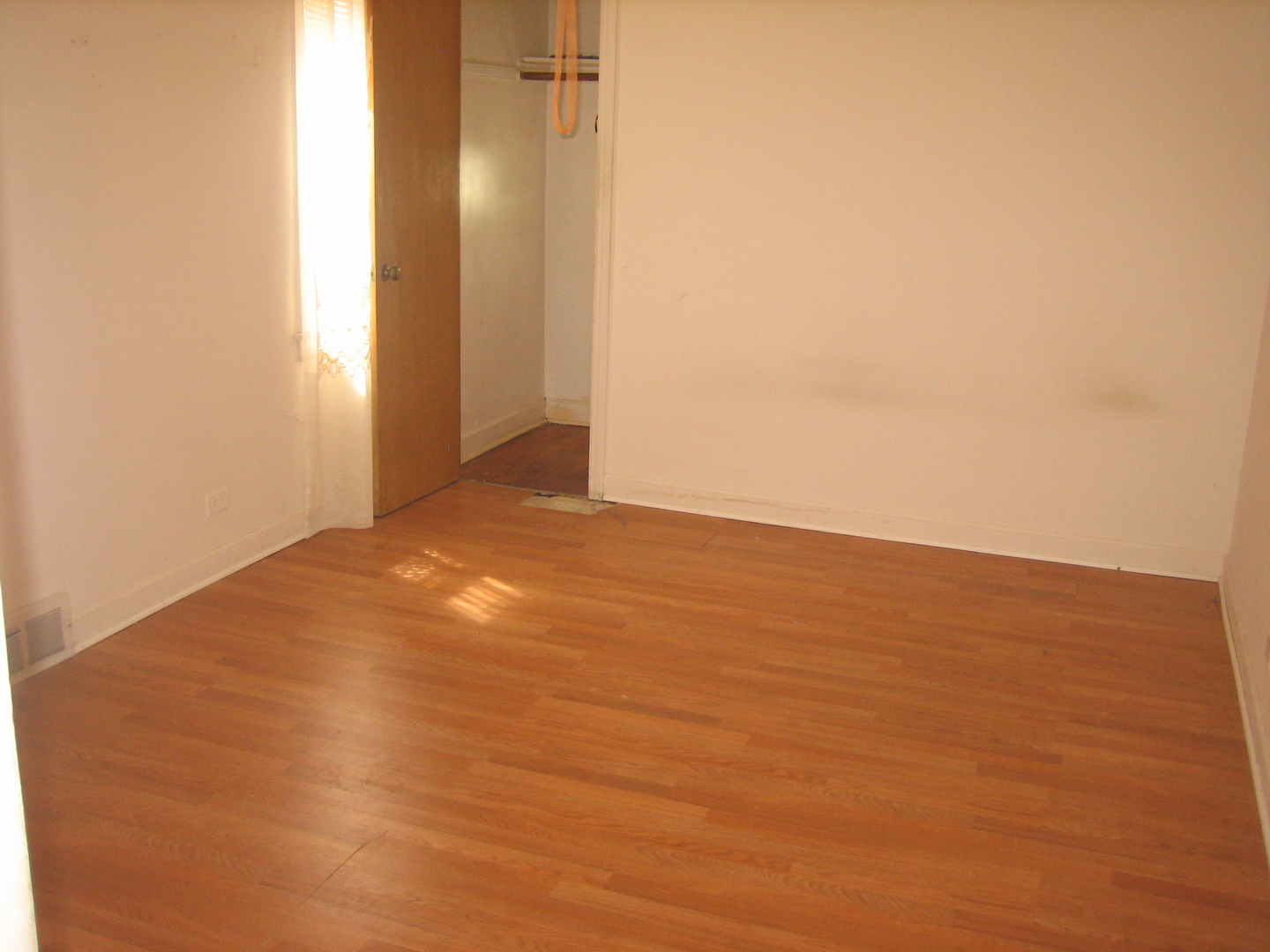 6141 North Harding Avenue Chicago, IL 60659 - Photo 9 of 11 a view of empty room with wooden floor