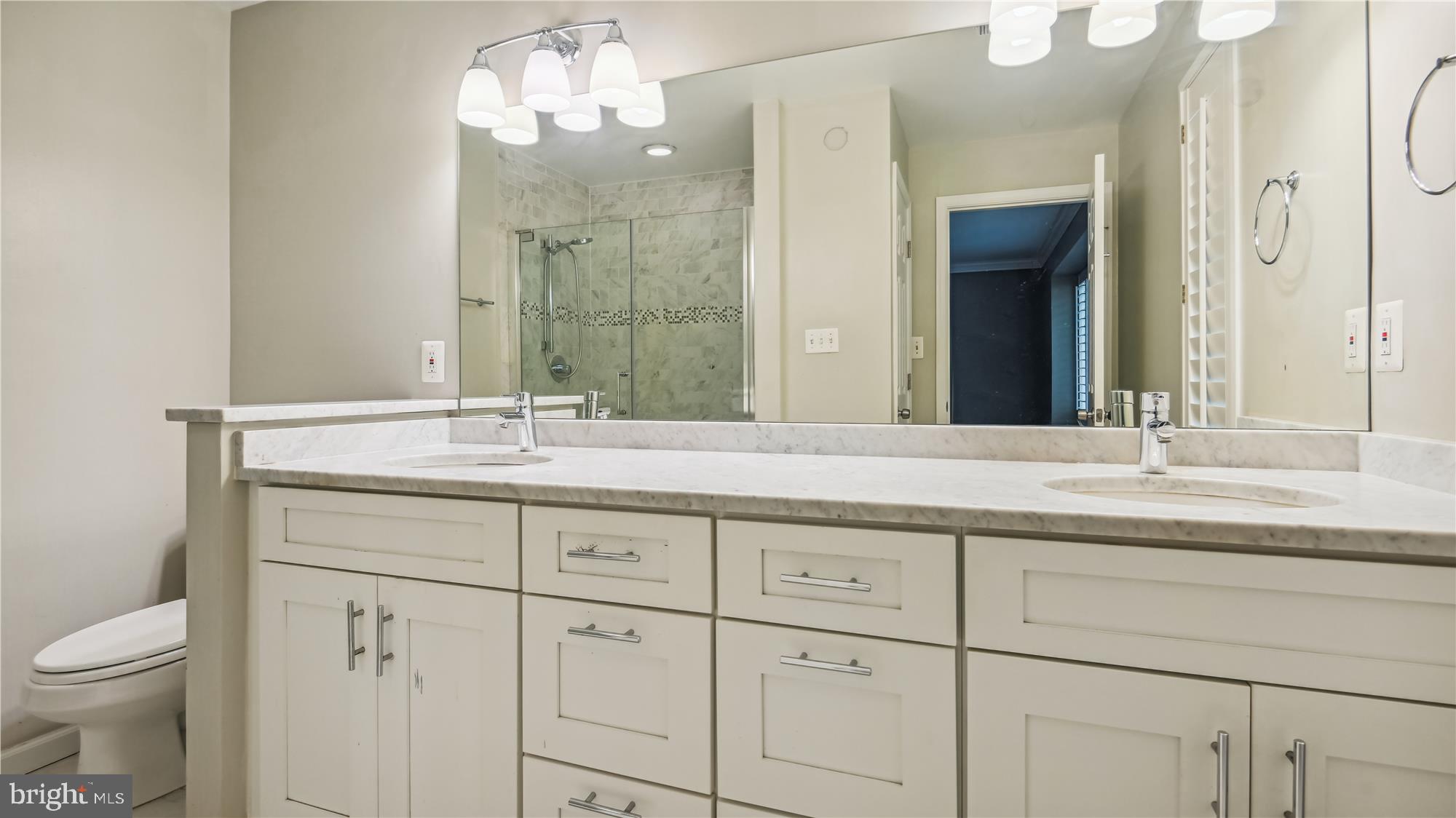 1411 Wolftrap Run Road Vienna, VA 22182 - Photo 27 of 48 Updated primary bath with dual sink vanity