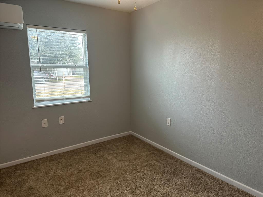 2058 Collins Avenue Abilene, TX 79603 - Photo 6 of 11 an empty room with a window