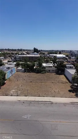 a vase with flowers sitting on a floor