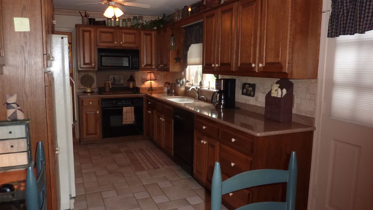 460 Wolf Ridge Road Bridgewater, VA 22812 - Photo 11 of 32 a kitchen with stainless steel appliances granite countertop a refrigerator and a stove top oven