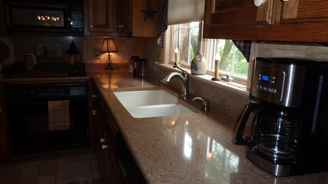460 Wolf Ridge Road Bridgewater, VA 22812 - Photo 13 of 32 a kitchen with a sink a counter top space and a window