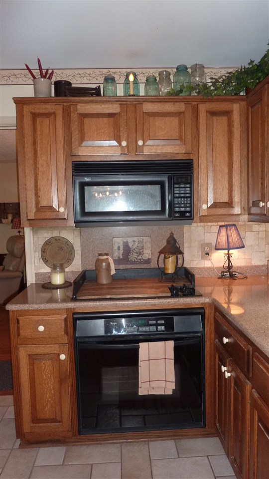 460 Wolf Ridge Road Bridgewater, VA 22812 - Photo 16 of 32 a stove top oven sitting inside of a kitchen