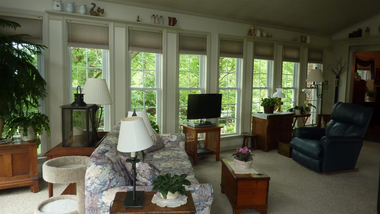 460 Wolf Ridge Road Bridgewater, VA 22812 - Photo 17 of 32 a living room with furniture a flat screen tv and a large window