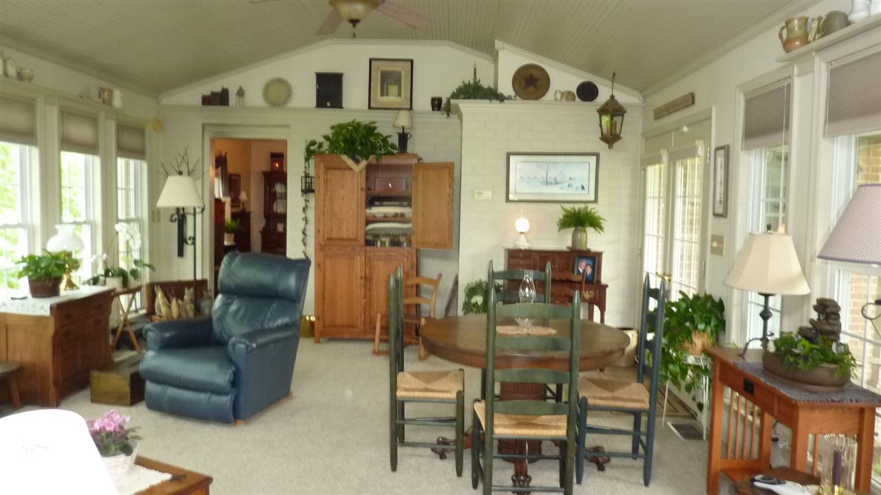 460 Wolf Ridge Road Bridgewater, VA 22812 - Photo 19 of 32 a living room with furniture and a chandelier