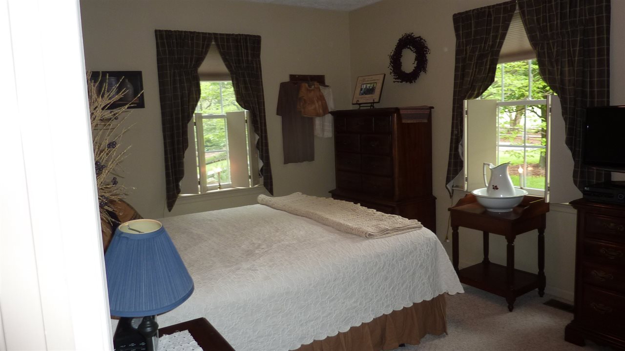 460 Wolf Ridge Road Bridgewater, VA 22812 - Photo 22 of 32 a bedroom with a bed and a window
