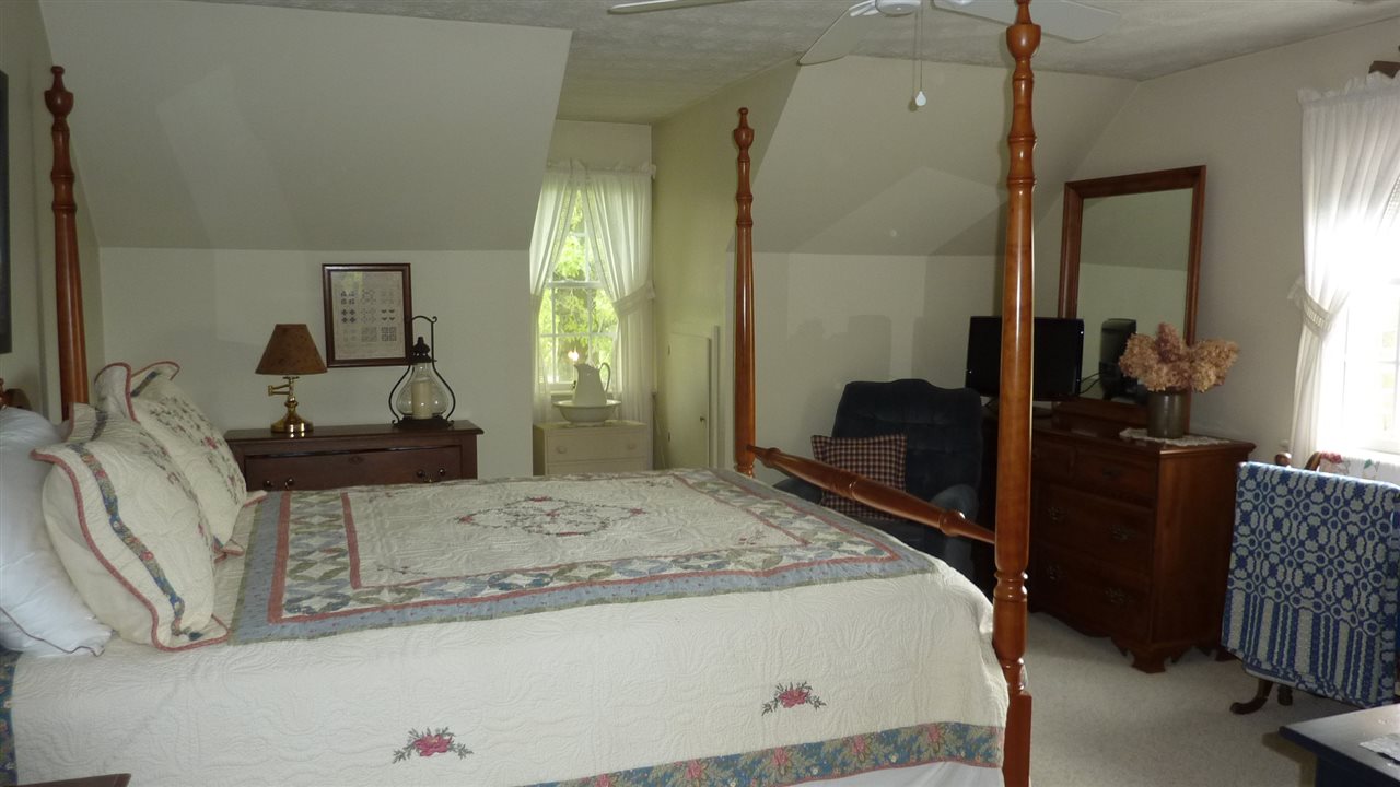 460 Wolf Ridge Road Bridgewater, VA 22812 - Photo 24 of 32 a bedroom with a bed and wooden floor