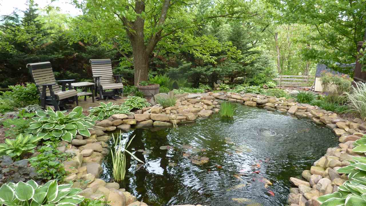 460 Wolf Ridge Road Bridgewater, VA 22812 - Photo 27 of 32 a backyard of a house with a yard table and chairs