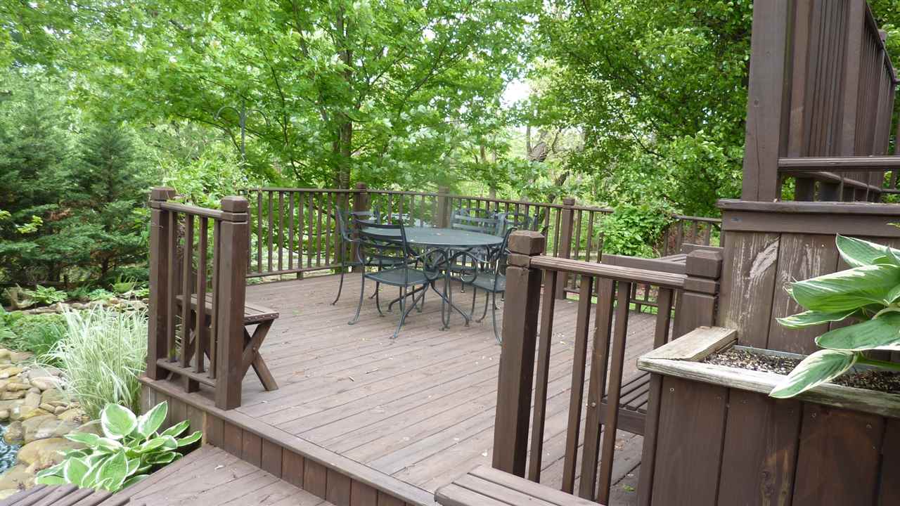 460 Wolf Ridge Road Bridgewater, VA 22812 - Photo 30 of 32 a view of a deck with chairs and wooden fence