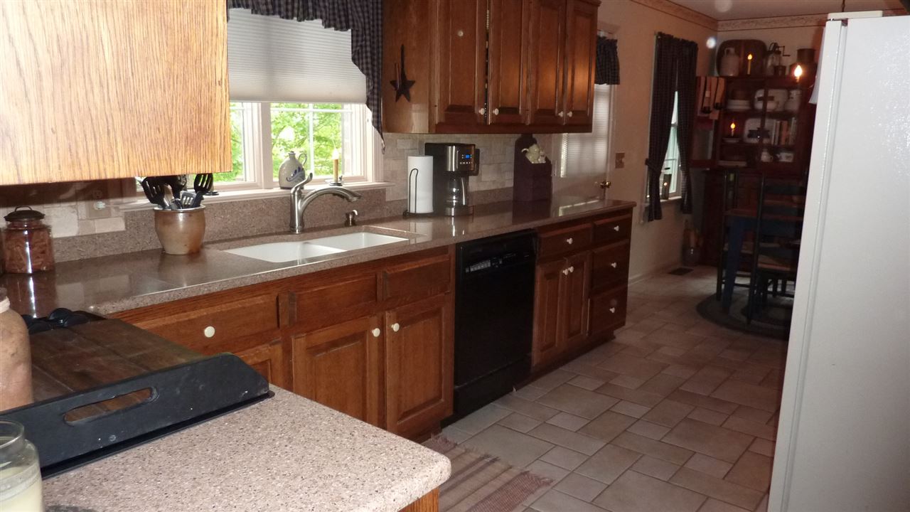 460 Wolf Ridge Road Bridgewater, VA 22812 - Photo 10 of 32 a kitchen with stainless steel appliances granite countertop a sink stove and cabinets