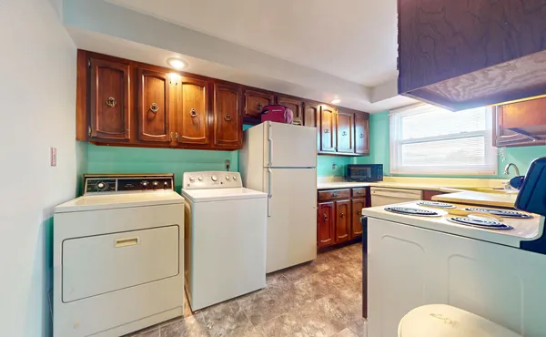 a utility room with dryer and washer