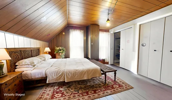 a bedroom with bed and a window