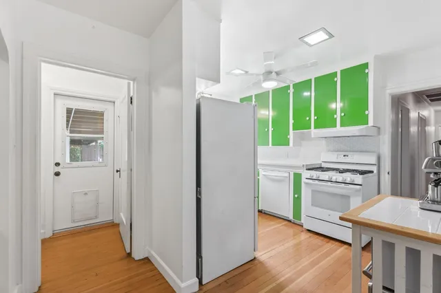 a kitchen with a refrigerator sink and stove