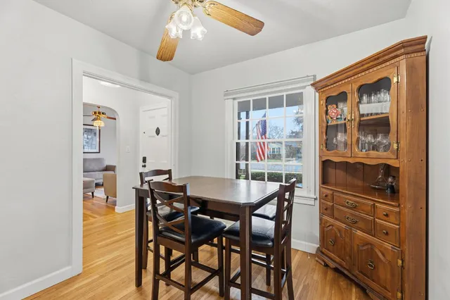 a dining room with furniture and window