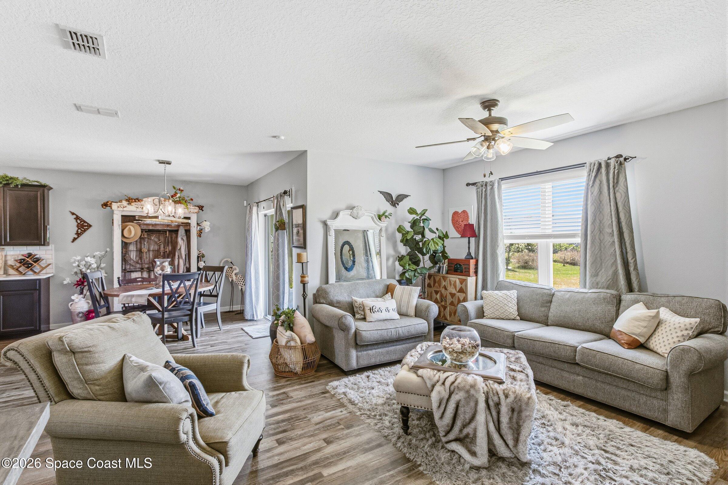 2213 McCormack Way Melbourne, FL 32935 - Photo 19 of 73 a living room with furniture or couch and a window