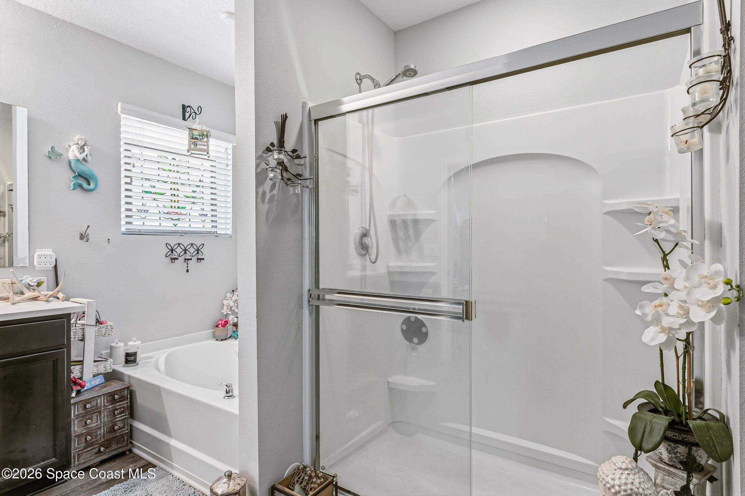 2213 McCormack Way Melbourne, FL 32935 - Photo 25 of 73 a bathroom with a tub a sink and a shower