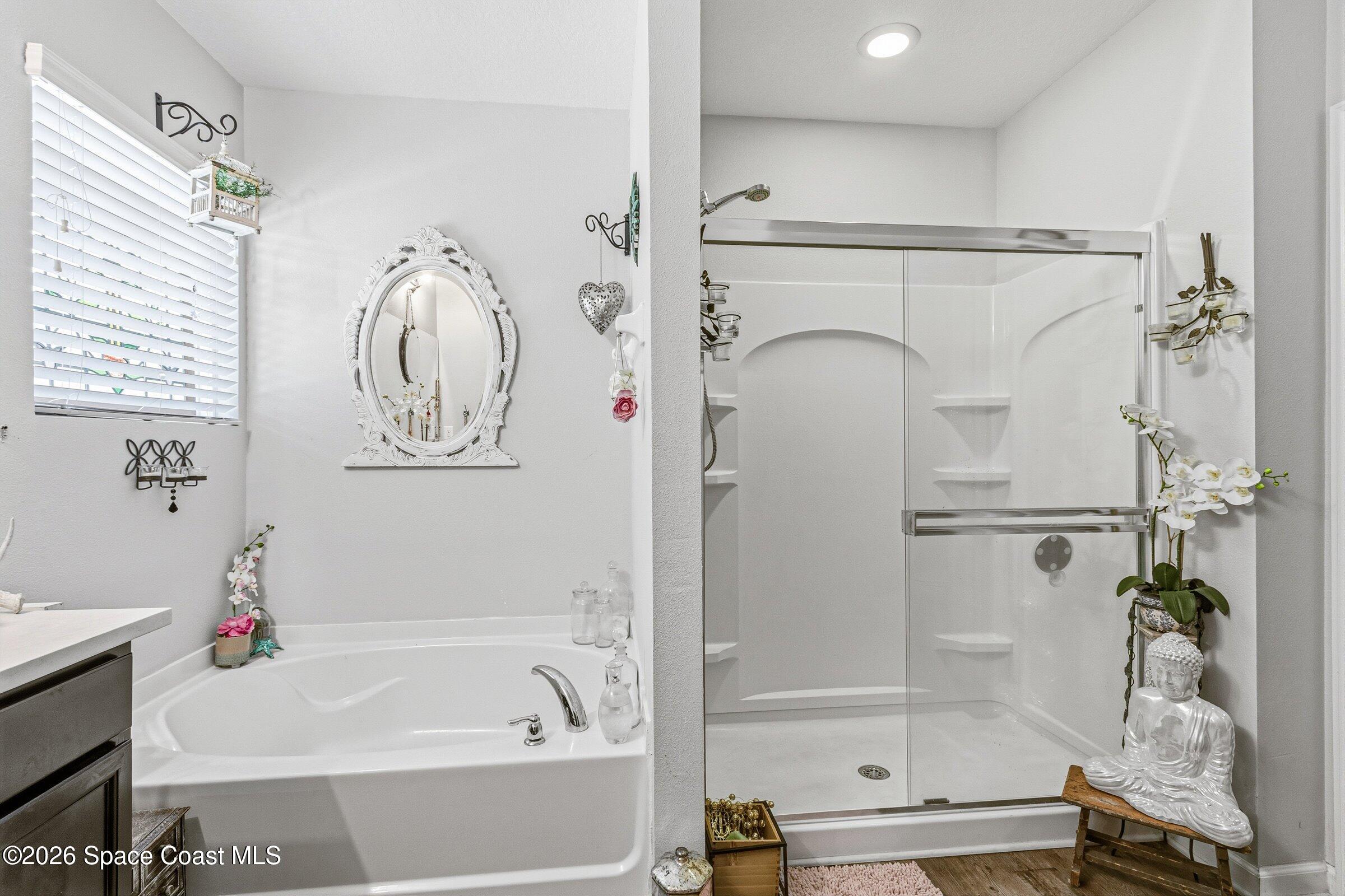 2213 McCormack Way Melbourne, FL 32935 - Photo 27 of 73 a bathroom with a bathtub and a shower