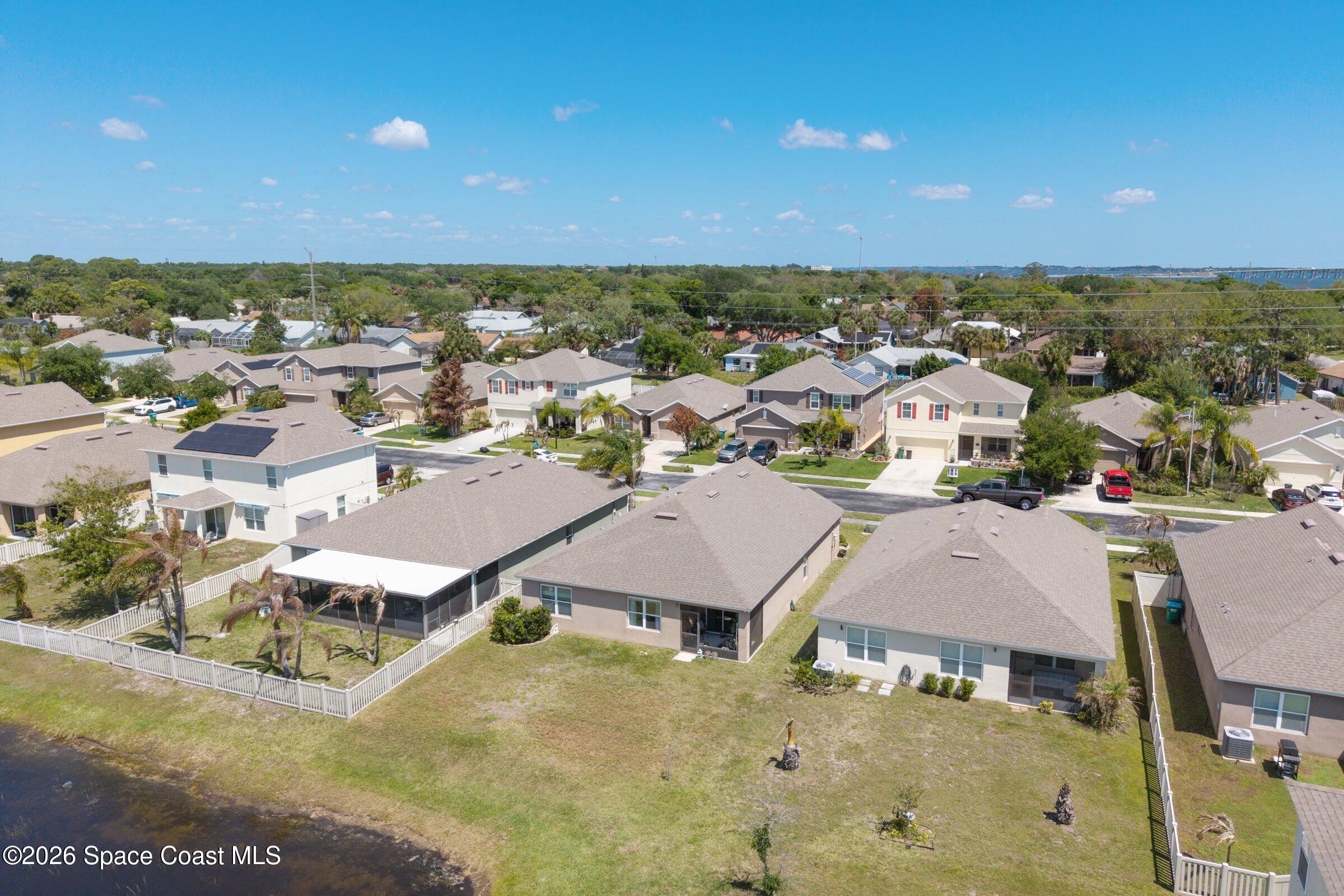 2213 McCormack Way Melbourne, FL 32935 - Photo 39 of 73 an aerial view of residential houses with outdoor space