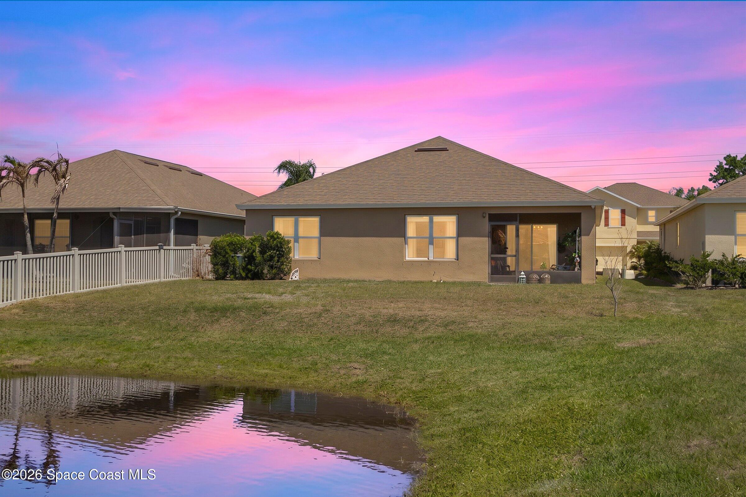 2213 McCormack Way Melbourne, FL 32935 - Photo 8 of 73 a front view of a house with a yard