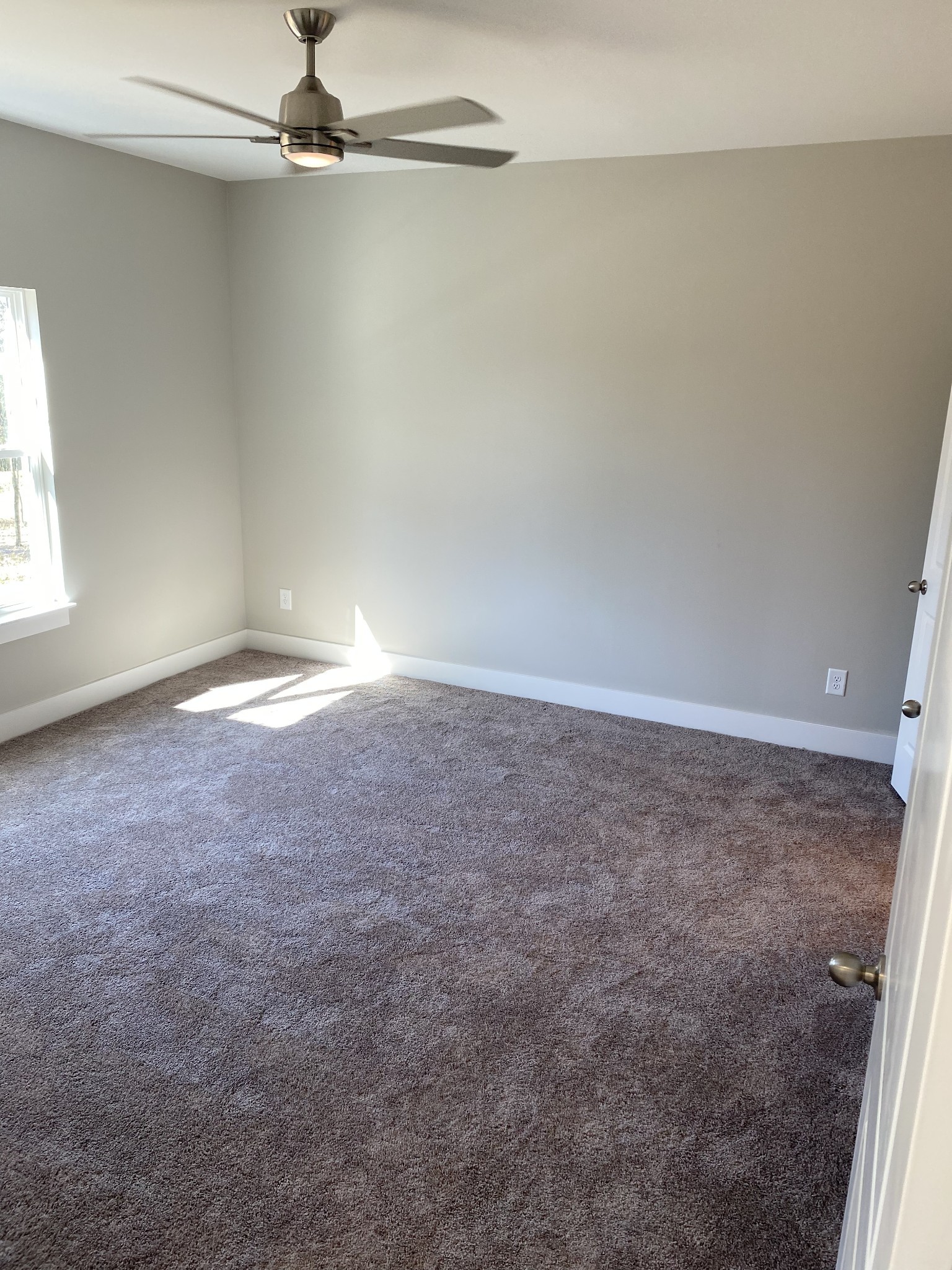 1144 Lock 4 Road, Unit J1 Gallatin, TN 37066 - Photo 23 of 52 Primary suite includes ceiling fan and view of beautiful backyard!