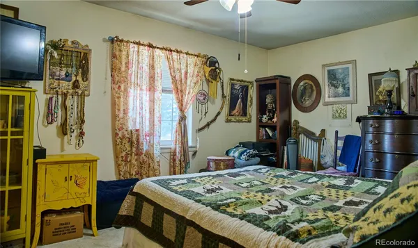 a bed room with a bed and a mirror