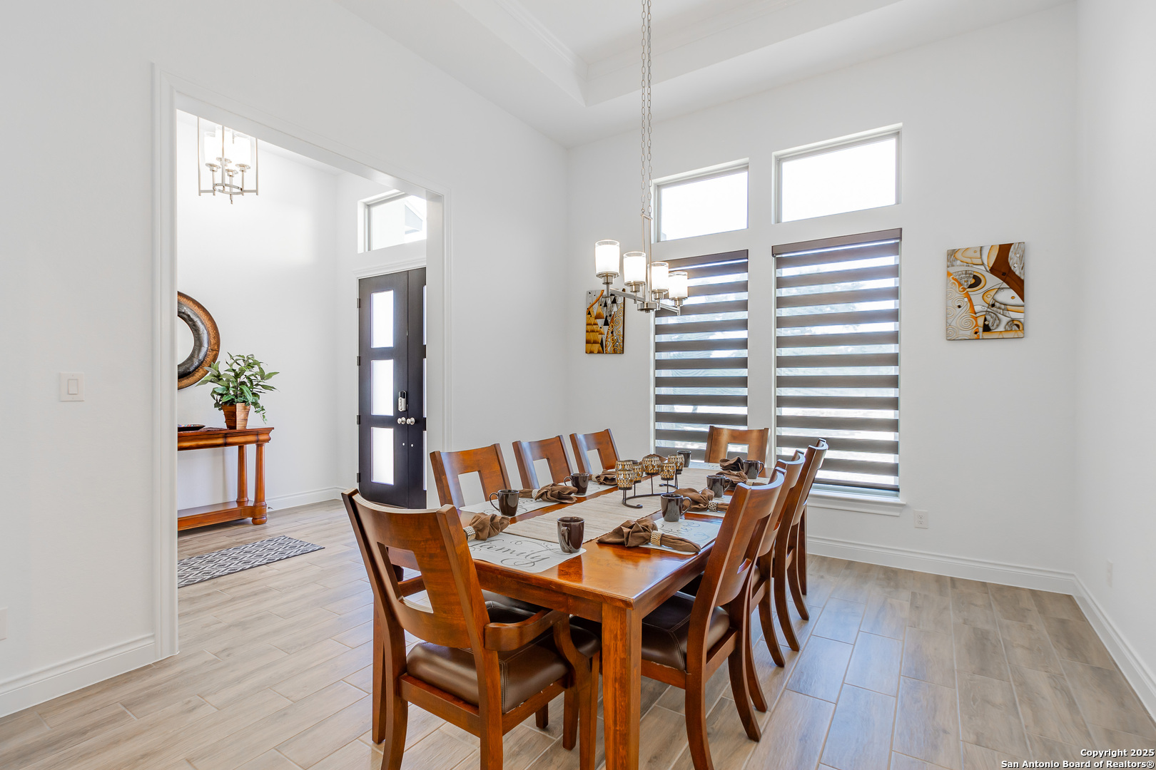 34784 High Gate Road Bulverde, TX 78163 - Photo 11 of 34 a view of a dining room with furniture and wooden floor