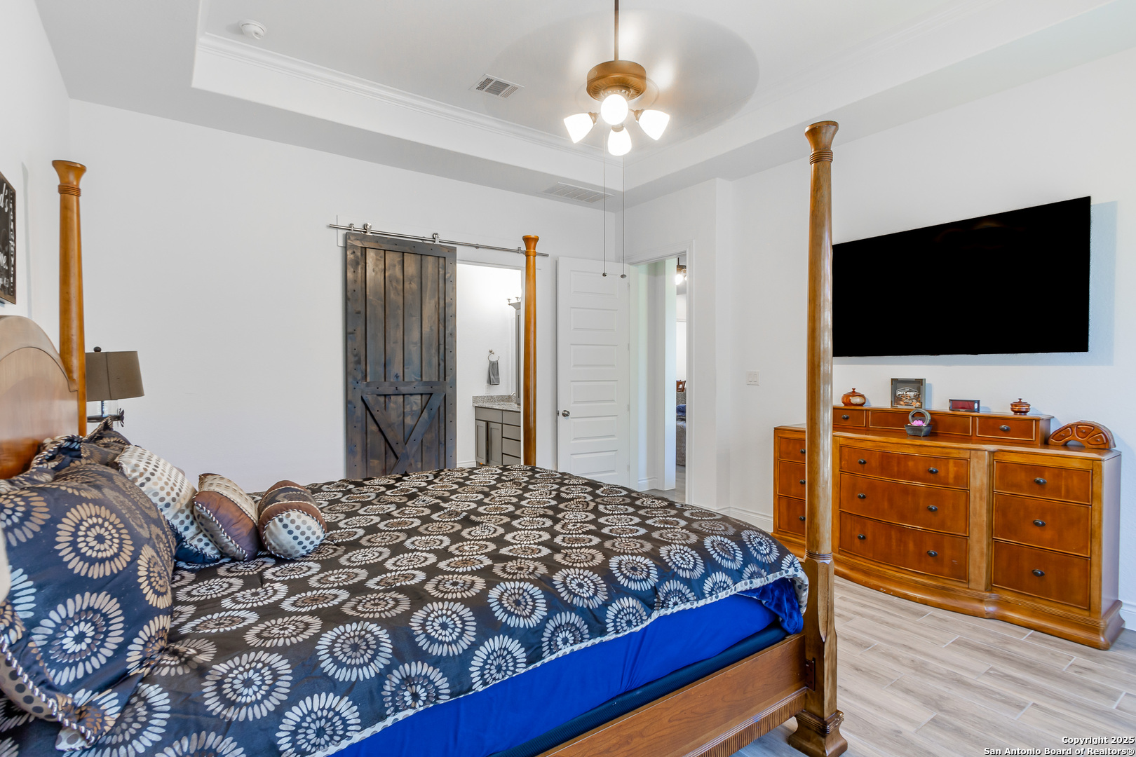 34784 High Gate Road Bulverde, TX 78163 - Photo 19 of 34 a bedroom with a bed and flat screen tv