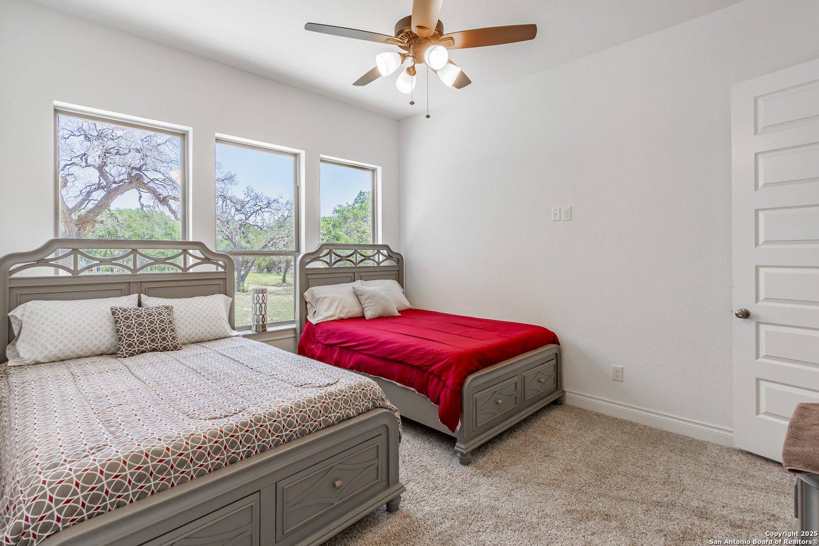34784 High Gate Road Bulverde, TX 78163 - Photo 23 of 34 a bedroom with two beds and a window