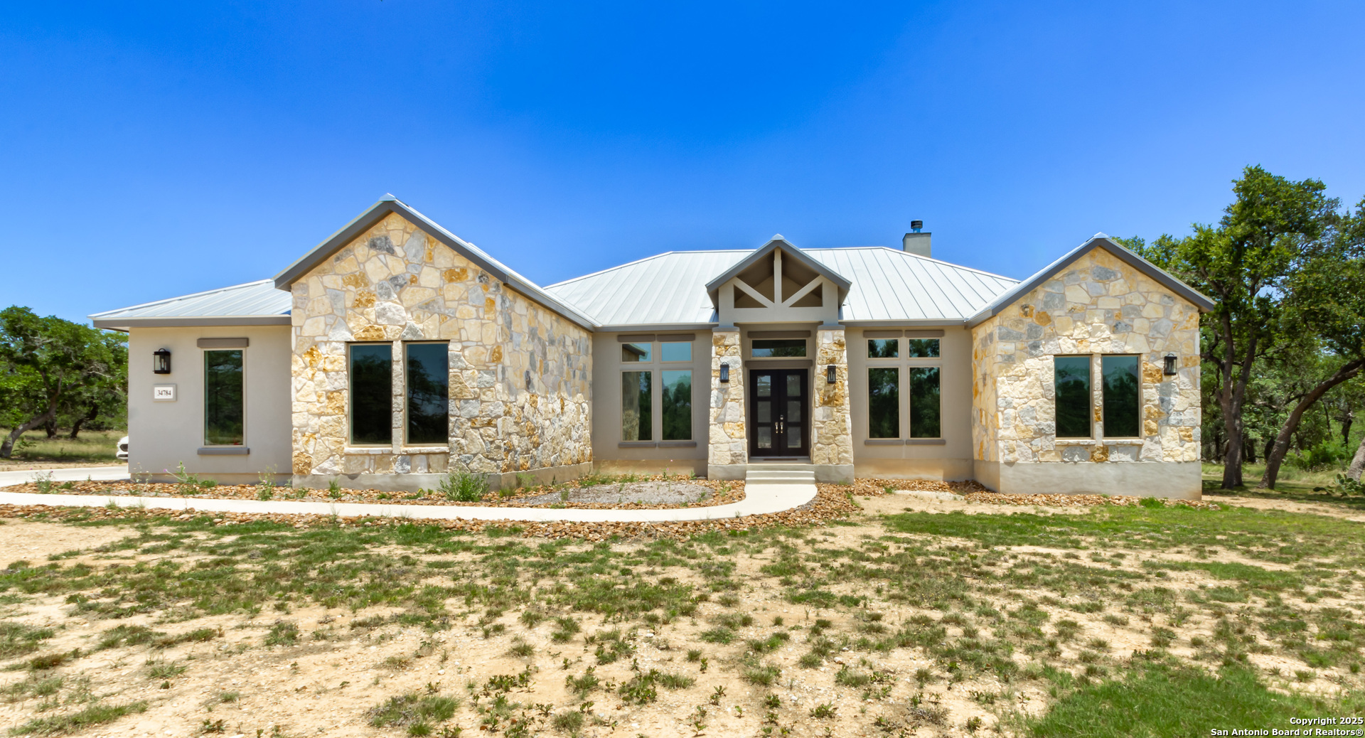 34784 High Gate Road Bulverde, TX 78163 - Photo 26 of 34 a front view of a house with a yard