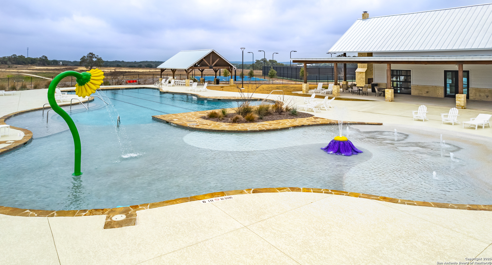 34784 High Gate Road Bulverde, TX 78163 - Photo 32 of 34 a view of a swimming pool with a lounge chair