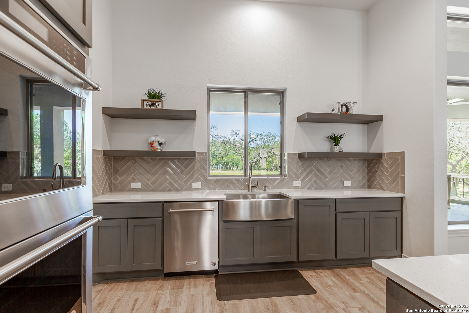 34784 High Gate Road Bulverde, TX 78163 - Photo 4 of 34 a kitchen with a sink and cabinets