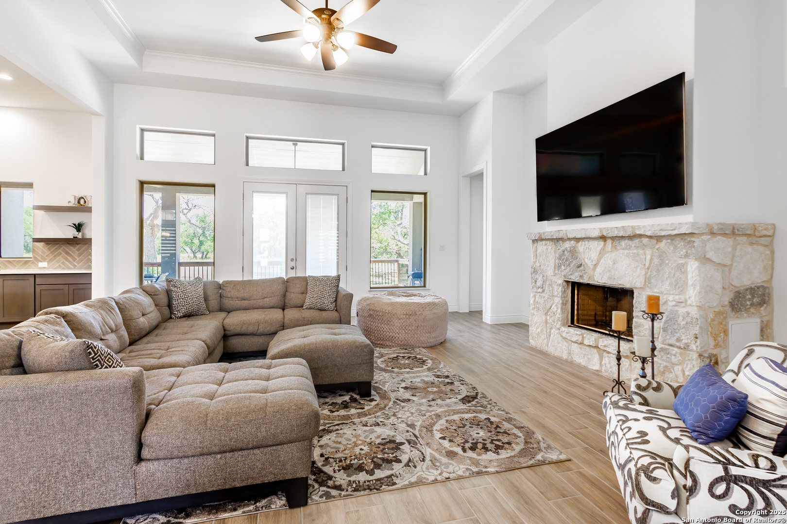 34784 High Gate Road Bulverde, TX 78163 - Photo 7 of 34 a living room with furniture fireplace and flat screen tv
