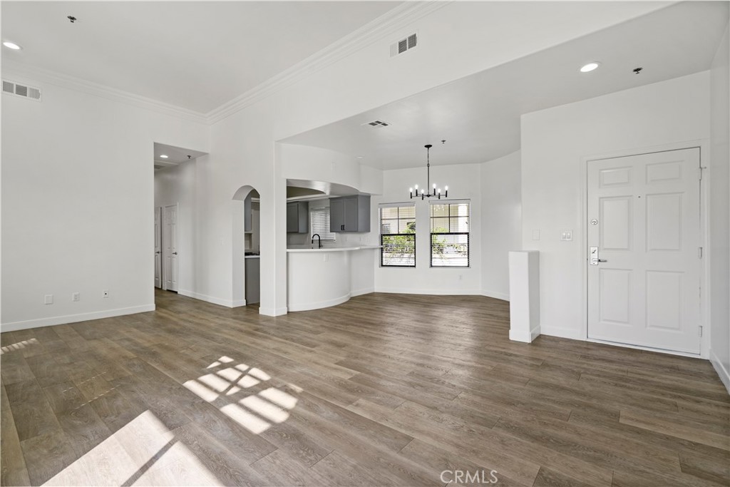 4623 Willis Avenue, Unit 305 Sherman Oaks, CA 91403 - Photo 12 of 74 a view of empty room with wooden floor and window
