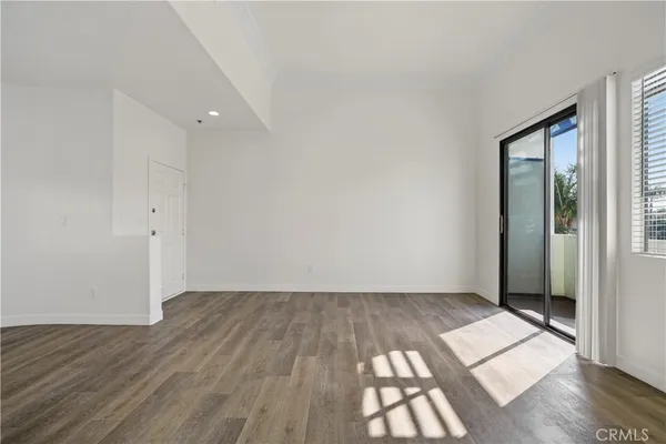 a view of empty room with floor and fireplace