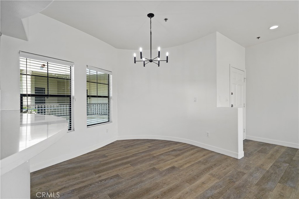 4623 Willis Avenue, Unit 305 Sherman Oaks, CA 91403 - Photo 15 of 74 wooden floor in an empty room with a window