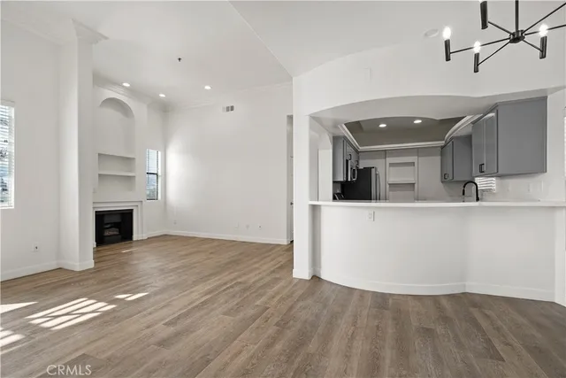 a kitchen with stainless steel appliances a stove a sink and a microwave