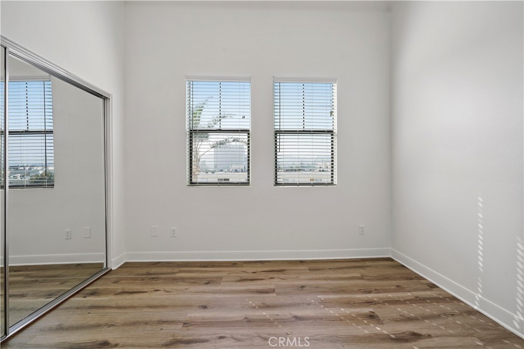 4623 Willis Avenue, Unit 305 Sherman Oaks, CA 91403 - Photo 43 of 74 a view of empty room with wooden floor and fan