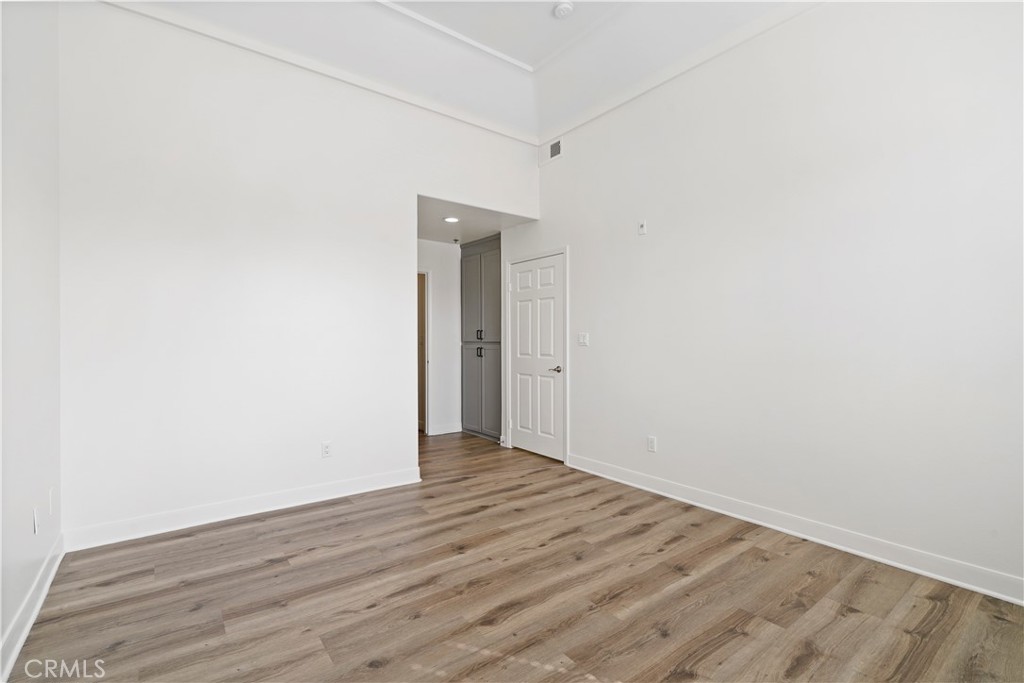 4623 Willis Avenue, Unit 305 Sherman Oaks, CA 91403 - Photo 48 of 74 a view of an empty room with wooden floor