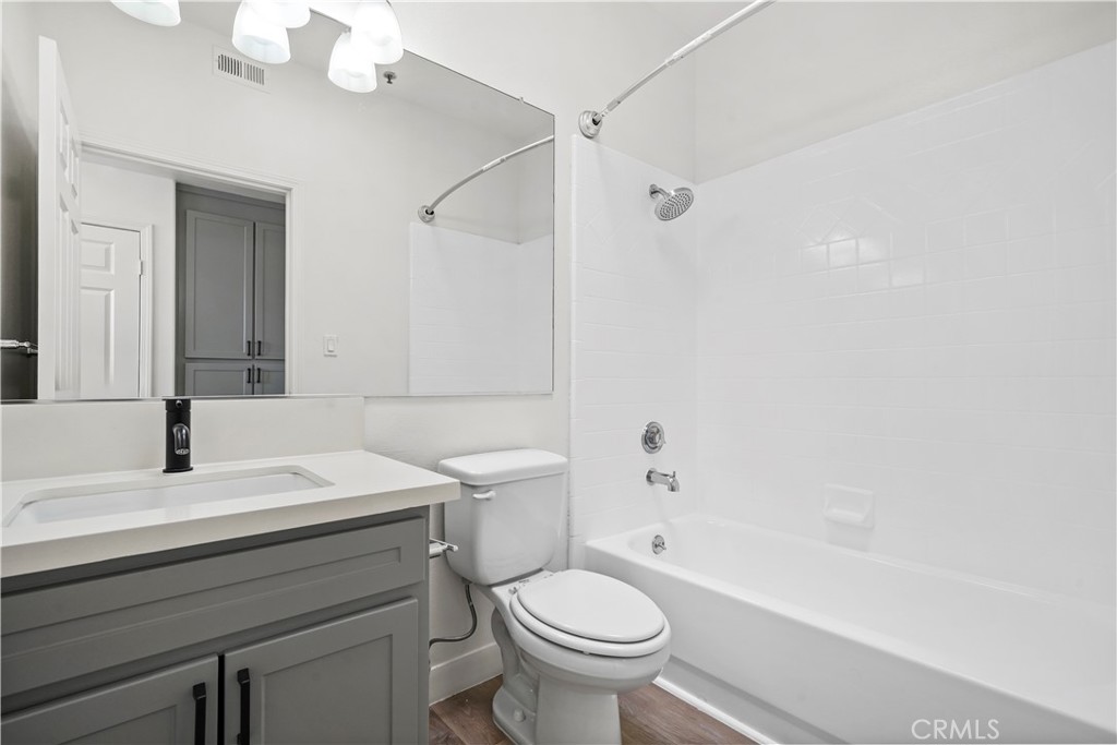 4623 Willis Avenue, Unit 305 Sherman Oaks, CA 91403 - Photo 52 of 74 a bathroom with a sink a toilet and a mirror