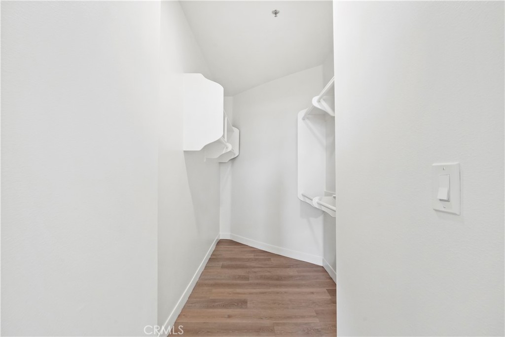 4623 Willis Avenue, Unit 305 Sherman Oaks, CA 91403 - Photo 54 of 74 a view of a hallway with wooden floor