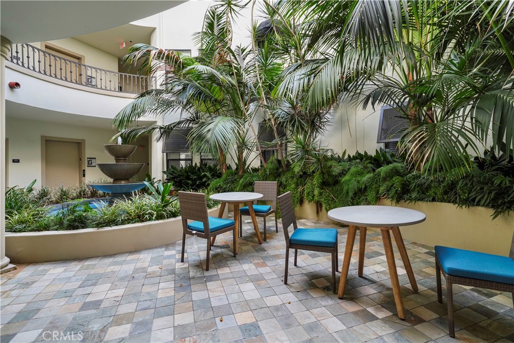 4623 Willis Avenue, Unit 305 Sherman Oaks, CA 91403 - Photo 66 of 74 a view of a chairs and table in backyard of a house