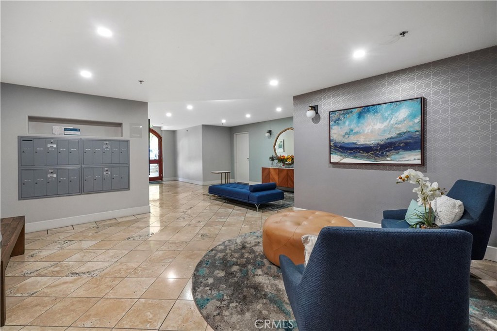 4623 Willis Avenue, Unit 305 Sherman Oaks, CA 91403 - Photo 7 of 74 a lobby with furniture and a rug