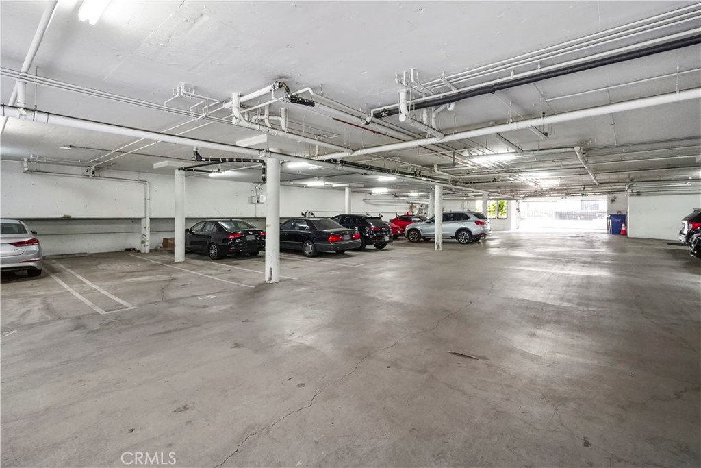 4623 Willis Avenue, Unit 305 Sherman Oaks, CA 91403 - Photo 72 of 74 a view of parking garage with cars