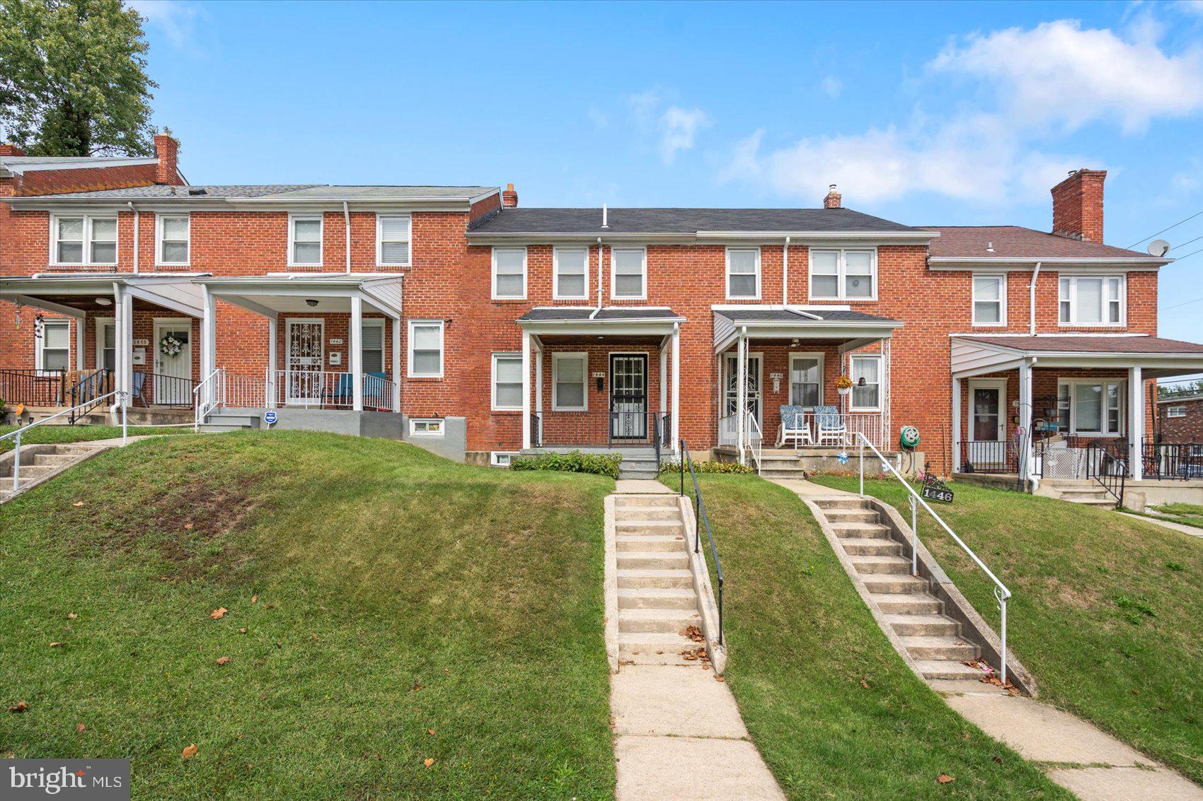 1444 Meridene Drive Baltimore, MD 21239 - Photo 1 of 36 a front view of a brick building with a yard